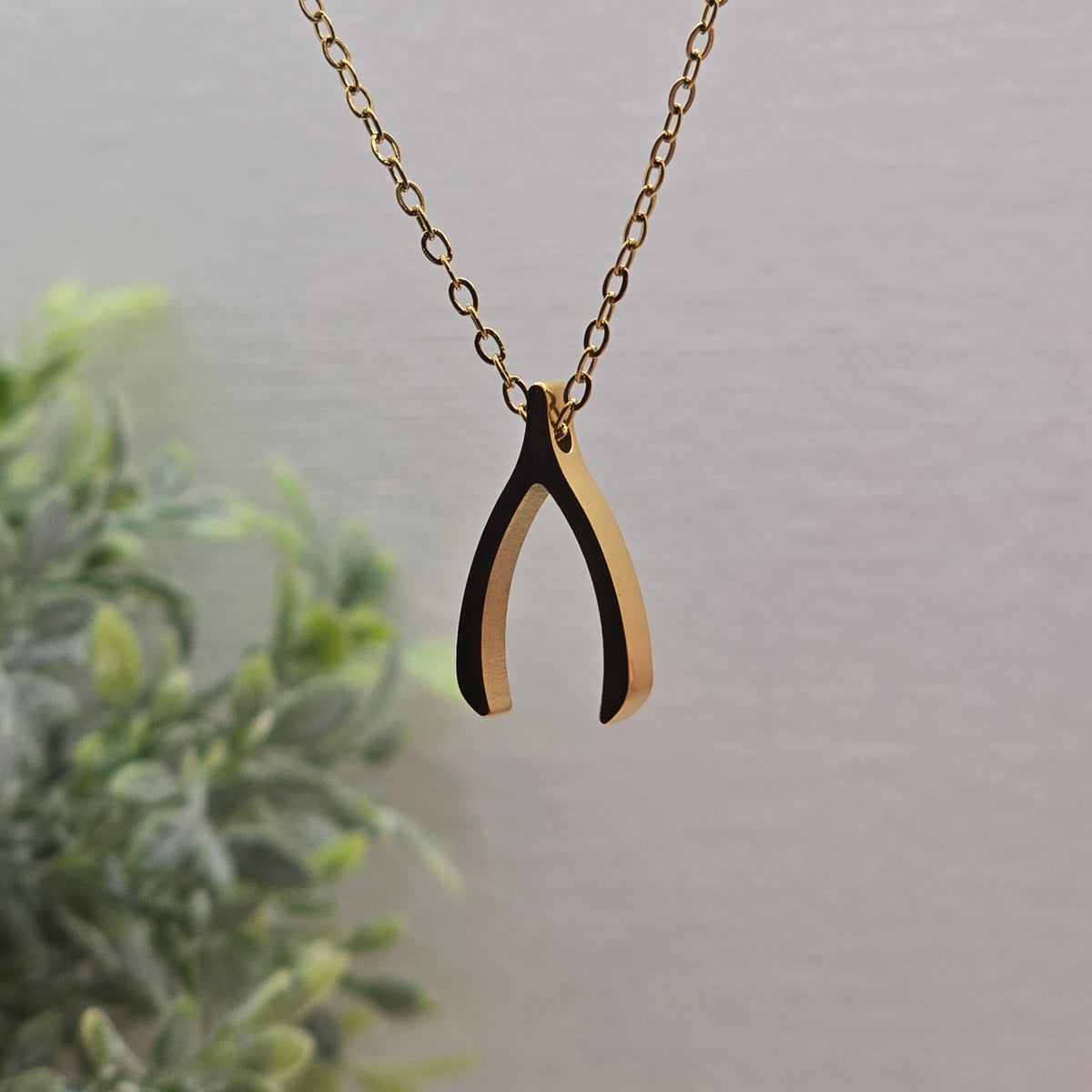 Wish necklace with delicate wishbone pendant in gold-plated stainless steel